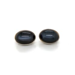Stephen Dweck silver clip earrings with oval cabochon black Diopside stone.